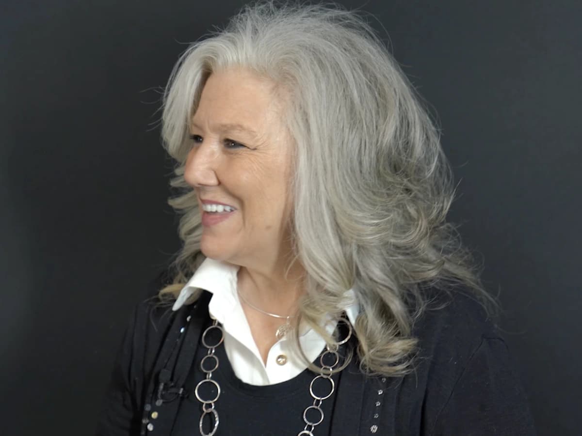 Patient smiling after full mouth dental implants